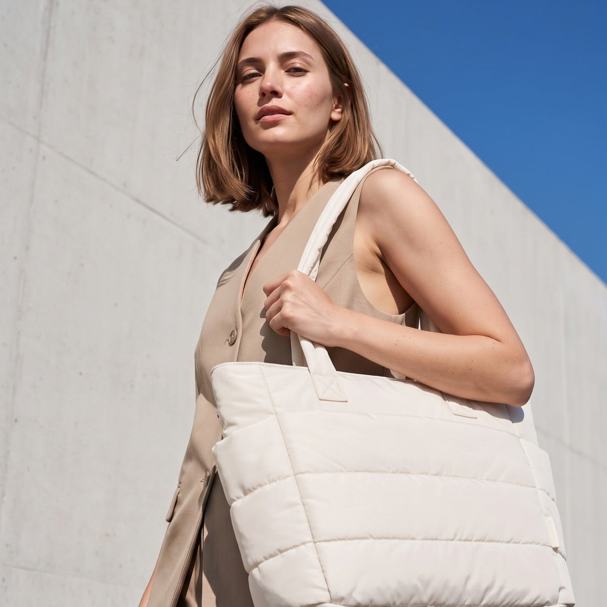 VELÁ Puffer Tote in Off-White, worn on the shoulder